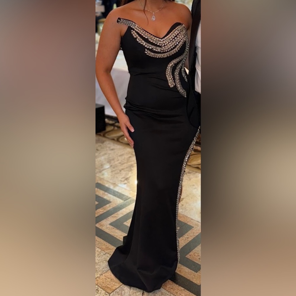 Black formal dress, gems lined throughout, inside boning, stretch material,